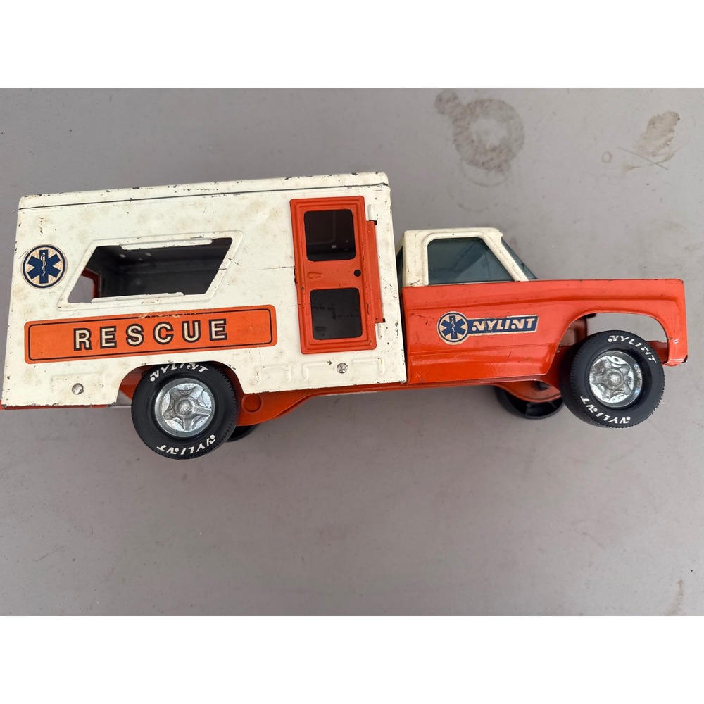 Vintage Nylint Pressed Steel Rescue Ambulance Truck Orange White Toy Made in USA